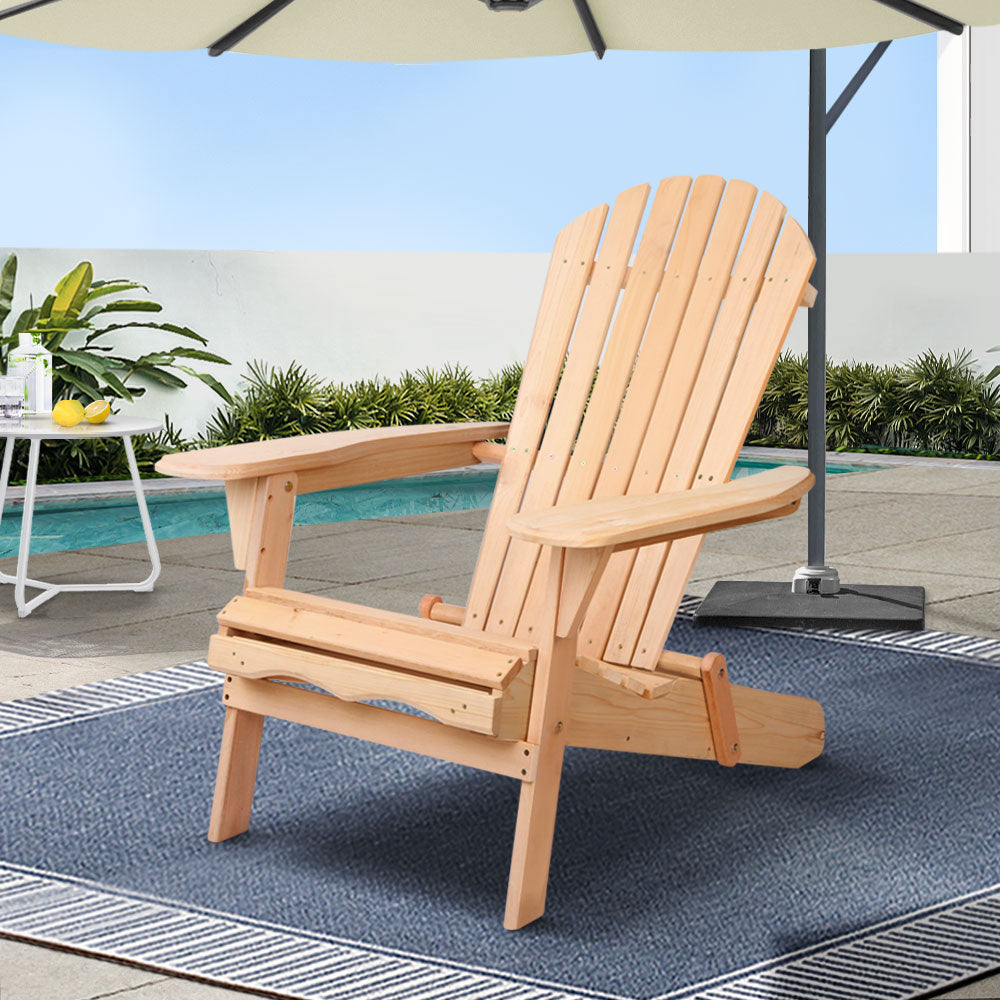 Natural timber Adirondack chair with wide armrests on a patio; styling accessories not included.