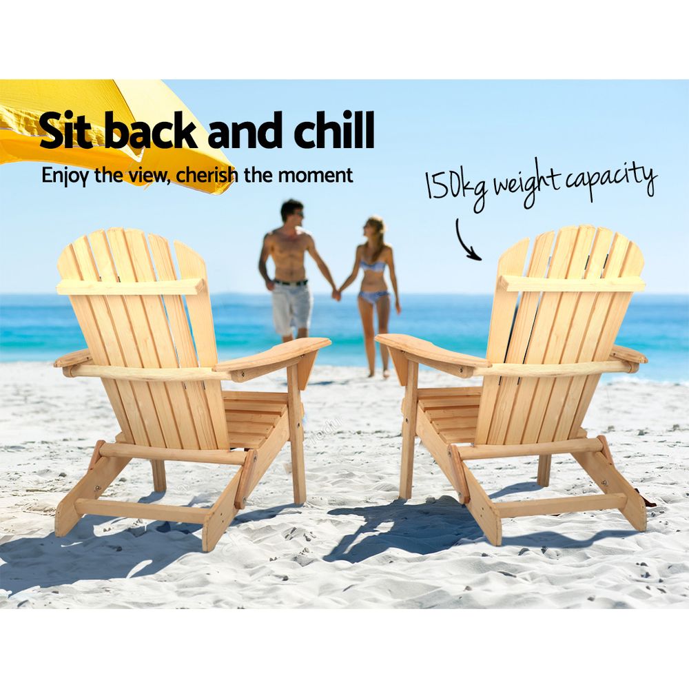 Two natural timber Adirondack chairs in a beach setting; this listing includes one chair.