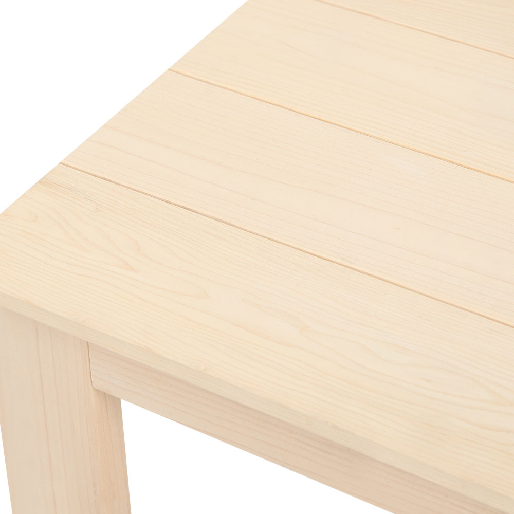 Close-up of the side table's timber tabletop and wood grain.