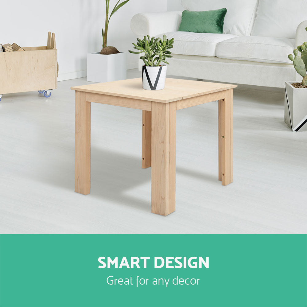 Timber side table with a potted plant in a living room; styling accessories not included.