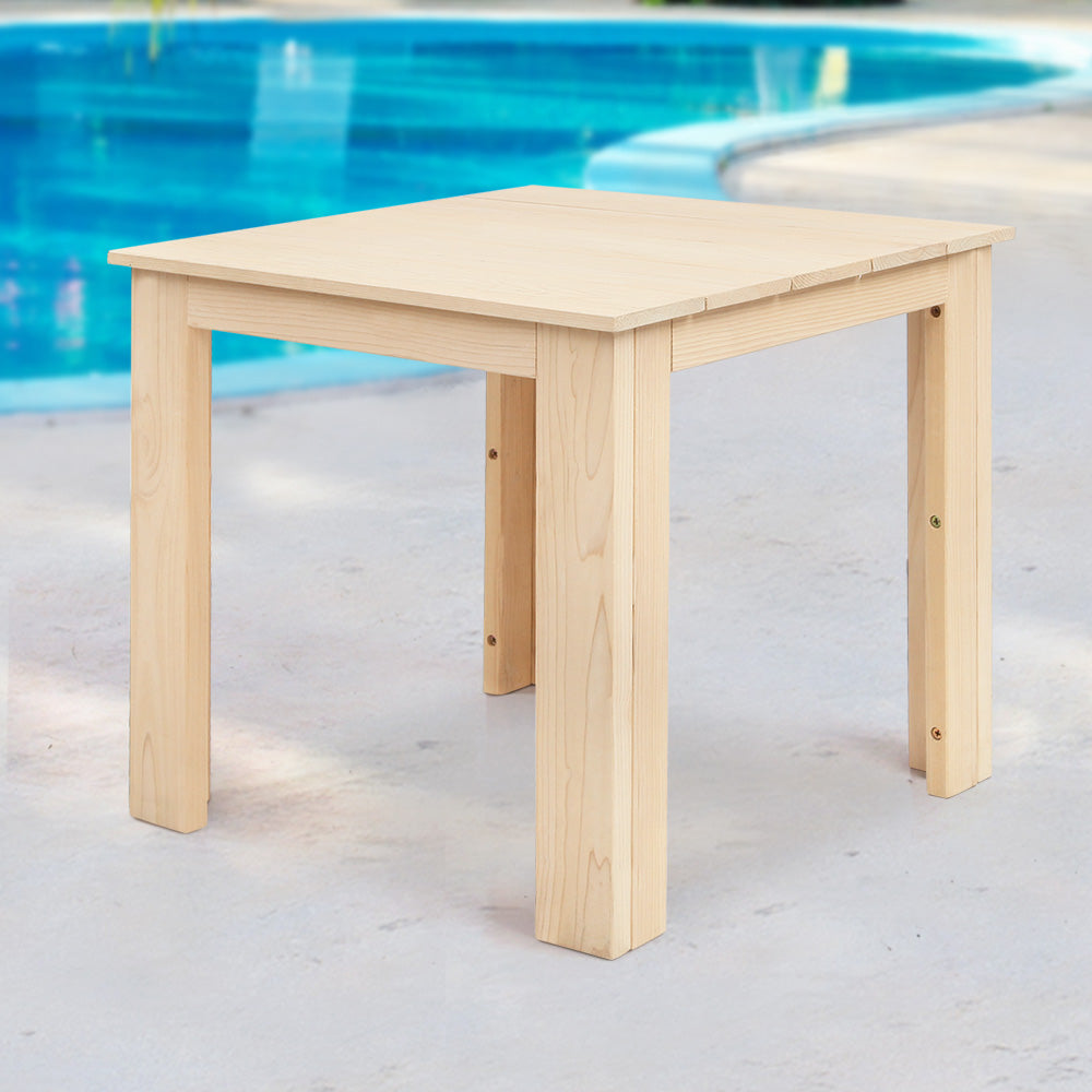 Natural timber side table beside a swimming pool.