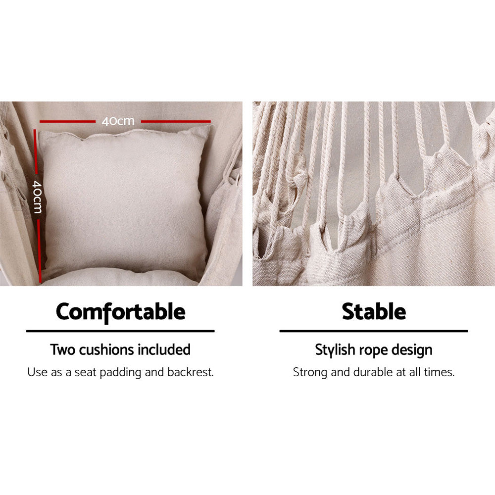 Close-up of a cream cushion and the hanging chair's fabric and rope attachments.