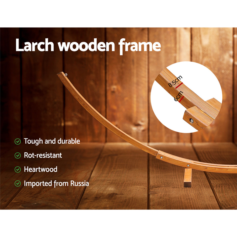 Close-up of the hammock stand's curved timber frame and bolted joint.