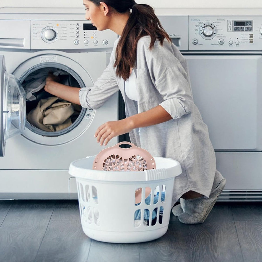 Silicone delicates protector beside a washing machine